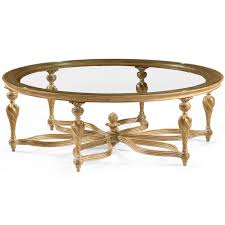 Lower shelf is covered in tightly woven rattan peel. French Neoclassic Table Oval French Neoclassic Coffee Table