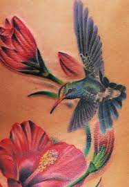 Japanese Blue Hummingbird And Red Flowers Tattoo Design Hummingbird Tattoo Tattoos Flower Tattoos