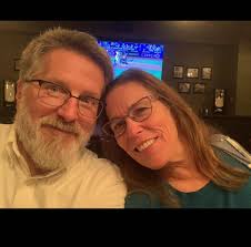 How to manage hyper behavior and play biting in a newly adopted dog?