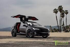 The 100d version of tesla's model x suv doesn't have the ludicrous mode of the p100d, but it's still quick and there's plenty about it that feels like the a thin, black wiring cover between the mirror and the header is the only aspect of the windshield design we'd deem unfortunate. Custom Black Model X P100d Over 60 000 In Customization Chrome Delete 22 Mx117 Forged Wheels Carbon Fiber Sport Designed Front Apron Auto Carros