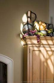 And the space above the kitchen cabinets, where it seems as if something should go there…but. Kitchen Cabinets Decorations On Top Of Kitchens Traditional Light Wood Kitchen Cabinets Kitc Kitchen Cabinets Decor Tuscan Decorating Tuscan Kitchen
