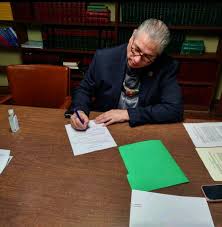 Chief Johnson signs a...