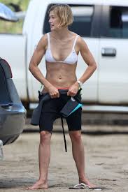 With bright blond hair, a beautiful set of baby blues, and soft white milky skin; Picture Of Rosamund Pike