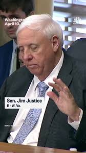 West Virginia Sen. Jim Justice and Babydog send a message of unity at a  Department of Energy hearing.