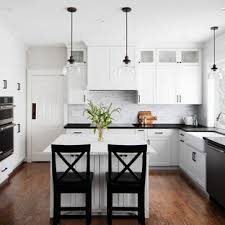 Gold accents including the brass faucet and cabinet hardware bring the bling. 75 Beautiful Kitchen With Marble Backsplash And Black Countertops Pictures Ideas July 2021 Houzz
