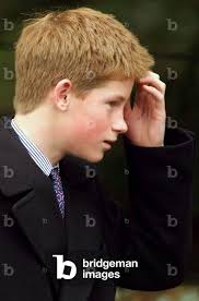 Image of PRINCE HARRY SMILES AS HE LEAVES A CHURCH SERVICE IN