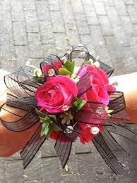 This premium prom corsage is on a gold bling bracelet with gold leaves, rhinestone bling, gold swirls and a gold butterfly. Hot Pink Black Wrist Corsage Corsage Prom Prom Corsage Pink Prom Flowers Corsage