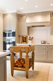Instead of the slight green undertones of manchester tan, muslin has a soft, subtle pink undertone, which makes it appear creamier. Butcher Block Island Transitional Kitchen Benjamin Moore River Reflections Charmean Neithart Interiors