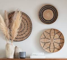 Did you ever use those woven rattan paper plate holders back in the day? Handwoven Basket Wall Art Pottery Barn