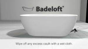 A freestanding soaking tub that is fine to bathe your children in or enjoy a relaxing bath for one. the drain and faucet are normally found on the opposing side of the seat. Badeloft Freestanding Bathtub Installation Using The Ez Drop In Drain Youtube