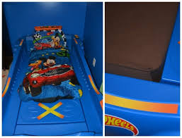 We have some cars ! Introducing The Step2 Hot Wheels Toddler To Twin Race Car Bed Thrifty Nifty Mommy