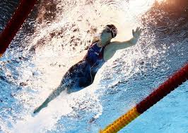 The prolific olympic swimmer wore a cap and gown over her swimsuit at olympic trials for a photo op. Rio Olympics Today U S Swimmers Restock Their Trophy Case The New York Times