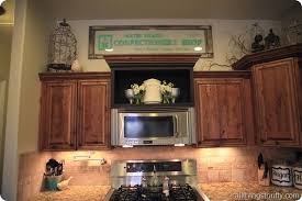 That open spot under the stairs. Decorations 2520above 2520cabinets 255b2 255d Jpg Image Above Kitchen Cabinets Cabinet Decor Cottage Style Kitchen