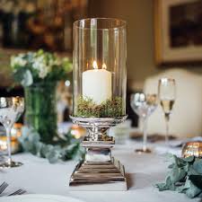 Benjara geometric design metal candle holder with glass hurricane,large,silver. Paris Glass Hurricane Lantern With Silver Stand Large Home Lifestyle From The Luxe Company Uk