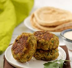 These Easy Baked Falafel Patties Are Sturdy With Bright Fresh Herbs Running Through Them Perfect With Pitas And This Simple Cream Baked Falafel Recipes Food
