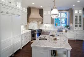 Thunder White Granite Pairs Well With The Pendant Lighting And White Cabinets White Granite Countertops Kitchen Remodel Countertops Luxury Kitchen Design