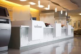 Reception Desk Shown In Vivigraphix Gradiance Glass With Switchgrass Interlayer Medical Office Design Reception Desk Design Reception Desk