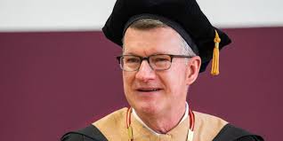 President Elzinga receives words of charge and encouragement from Calvin  Prison Initiative students ahead of formal inauguration