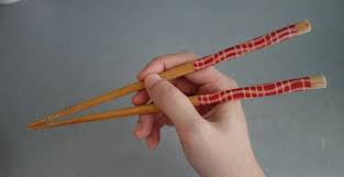 Hold the bottom chopstick between your thumb and ring finger. The Essential Guide To Chopsticks Etiquette