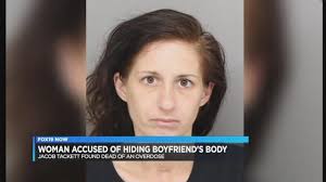 Court records: Woman tried to hide dead boyfriend under clothes in motel