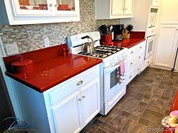 Kitchen Remodel White Cabinets With Smoked Glass Polished Silver Hardware And Red Caesarstone C Kitchen Counter Design Kitchen Remodel Small Kitchen Remodel