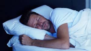 Image result for picture of a man sleeping on a bed