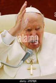 Pope John Paul II delivers his blessing at the end of the Angelus prayer in  the courtyard of his summer residence in Castelgandolfo, in the outskirts  of Rome, Sunday, Aug. 29, 2004. (AP Photo/Gregorio Borgia Stock Photo