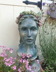 Can you identify the head planter as a mask of 'The Rock'?