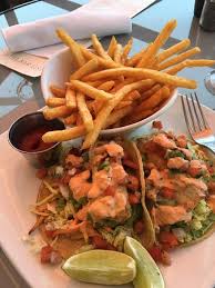 Divide the fish among the tortillas and garnish with shredded cabbage, cilantro, red onion slices, avocado, sriracha mayo and lime slices. Fish Tacos And Great View Picture Of Edgewater Grill San Diego Tripadvisor