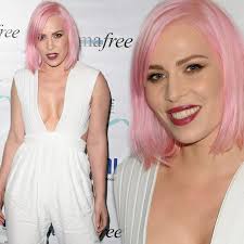 Natasha Bedingfield looks barely recognisable in plunging white jumpsuit  with PINK hair