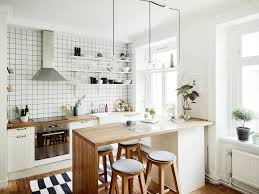 While it isn't the most popular design style, it only appears in about 0.74% of 1.78 million kitchens in a design survey; Decorations Chic Scandinavian Style Interior Decor Kitchen With White Plaid Ceramic Backs Small Apartment Kitchen Kitchen Remodel Small Kitchen Decor Apartment