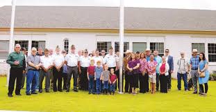 County salutes US flag