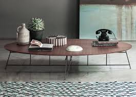 An oval coffee table with a glass top will keep the room feeling light and airy, while those made of thick slabs of marble or concrete will command more attention. Lema Mr Zheng Oval Coffee Table Lema Furniture At Go Modern London