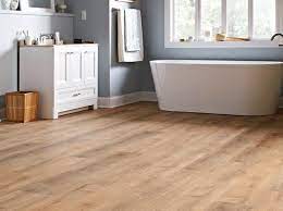 Can You Install Vinyl Flooring Over Ceramic Tile Hunker In 2021 Vinyl Flooring Flooring Wood Laminate