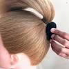 Pull hair into a low ponytail and tie with a hair elastic. 3