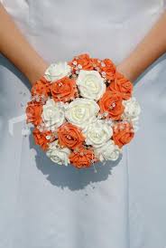 Though it looks like this bouquet is just a bunch of roses, the rounded shape is dependent upon creating a teepee shape with the stems so the flowers won't be squashed together. Mixed Colors Wedding Bouquets Bride Wedding Bouquet Orange Roses Silk Wedding Bouquets