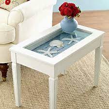 Shop our best selection of coastal & nautical coffee tables to reflect your style and inspire your home. Display Table Ideas For Shells Beach Finds Coffee Tables Accent Tables Coastal Decor Ideas Interior Design Diy Shopping