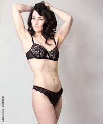 Beautiful mature woman in lingerie posing in studio Stock Photo | Adobe  Stock