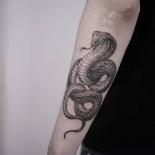 People who decide to get a snake tattoo usually have a profound relationship with nature. Best Snake Tattoos Designs Ideas January 2021 Snake Tattoo Design Black Snake Tattoo Cobra Tattoo