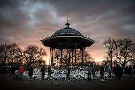 Floral tributes and a poster saying 'she was only walking home' are placed in tribute to sarah. Lcig Rfvbrxrom