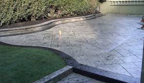 The base color is chestnut with splashes of brick red and expresso color hardener. Cmdt Systems Decorative Stamped Concrete Patios In Vancouver Lower Mainland