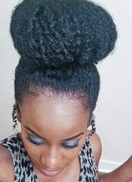 Insert your ponytail through the center of your bun form and roll it down. An Easy To Style Natural Hair Bun Using Braiding Hair For Black Women Natural Hair Bun Styles Bun Hairstyles Natural Hair Styles