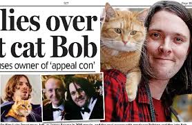 Fur f lies over street cat Bob