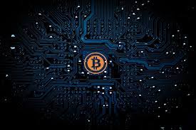 A physical imitation of the bitcoin cryptocurrency is pictured with a $1 bank note. Corporate Structuring Banking For Cryptocurrency Business