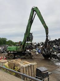 Firefighters prevent blaze from igniting mountain of junk cars in  Plainfield Township
