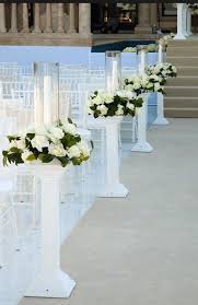 Hurricane Lamps With Flower Rings On White Columns Wedding Columns Wedding Pillars Wedding Aisle