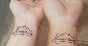You should get this viking symbol on your leg if you are into larger tattoos. Amazing Mountain Adventure Wrist Travel Tattoo Idea For Couples 1