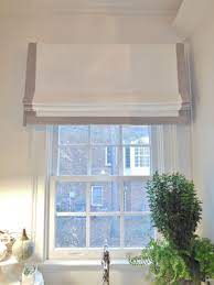 Window roller shades are a simple way to cover your windows and block light from coming in. Banded Faux Flat Roman Shade This Was The Perfect Choice For This Laundry Room Roman Blinds Living Room Flat Roman Shade Window Treatments Living Room