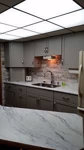 Oak Cabinets In A Harbor Mist Sheer Finish With Calacutta Marble Laminate Countertops Kitchen Cabinets In Bathroom Kitchen Laminate Countertops