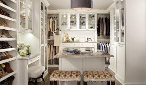 What is great about islands is they provide a place to set out clothes for tomorrow, an area to sort and fold laundry provide a surface to display a piece of art which brightens your day. Dream Closet Ideas Transitional Closet